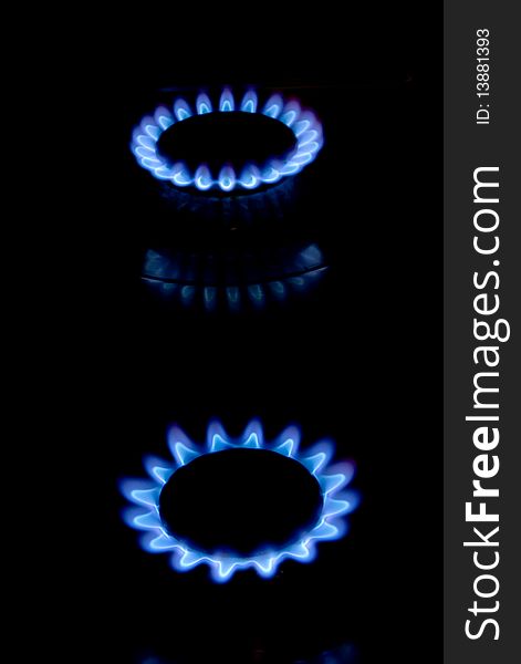 Blue flame of burning gas in kitchen stoves. Blue flame of burning gas in kitchen stoves