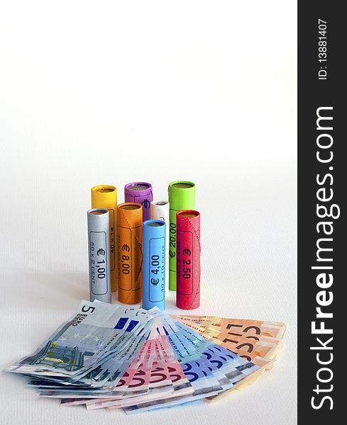 Euro notes and coins in colored packages. Euro notes and coins in colored packages