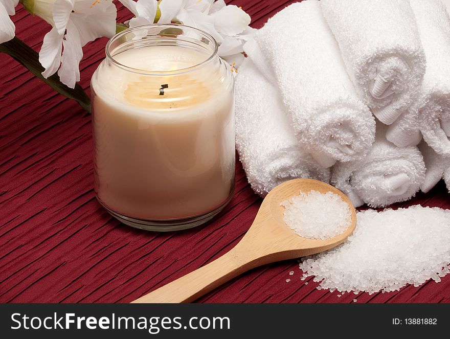 Candle, sea salt, flower and towels. Candle, sea salt, flower and towels