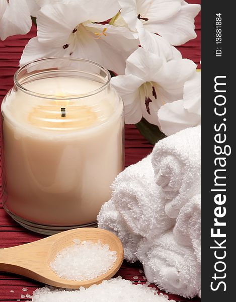 Candle, sea salt, flower and towels. Candle, sea salt, flower and towels