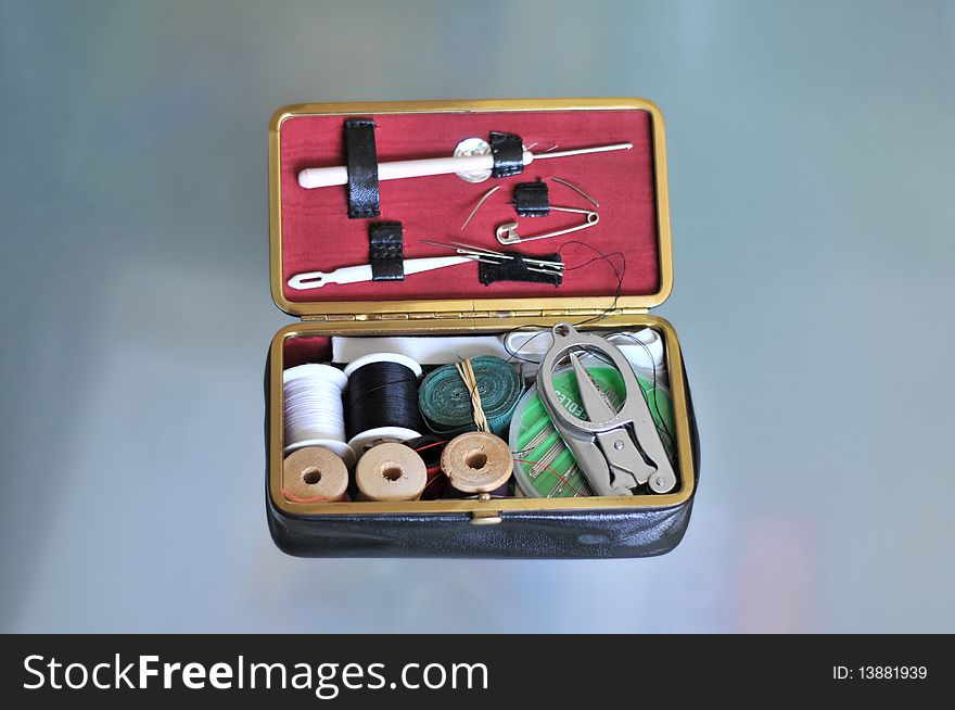 Tailoring tools laying on a glass table