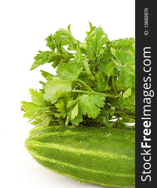 Cucumbers and parsley on a white background