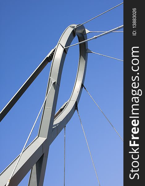 An abstract detail of a futuristic metal structure over a blue sky (abstract wallpaper). Aveiro, Portugal