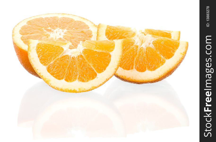 Close-up cut oranges with reflection, isolated on white
