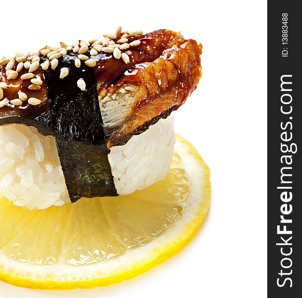 Japanese Cuisine - Eel (unagi) Nigiri Sushi. Topped with Eel Sauce and Sesame. Served on Lemon Slice. Japanese Cuisine - Eel (unagi) Nigiri Sushi. Topped with Eel Sauce and Sesame. Served on Lemon Slice