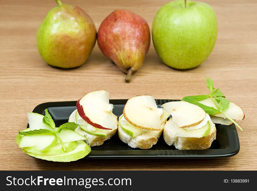Delicious canapes with french cheese and fruits