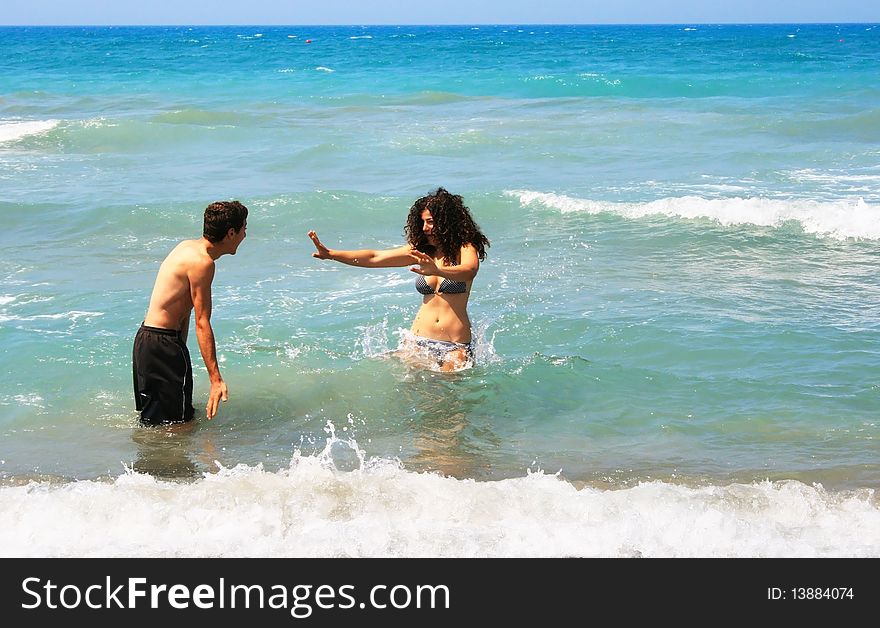 Couple having fun in the sea.