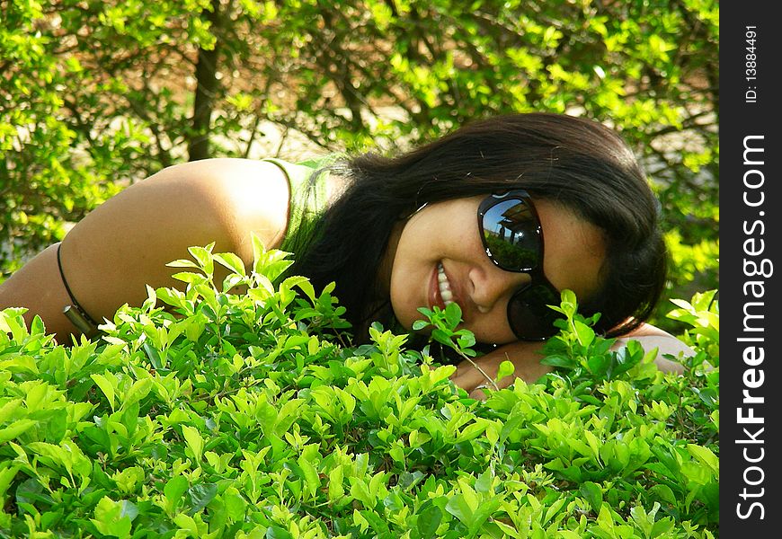 A youngster happily lying on the meadow. A youngster happily lying on the meadow.