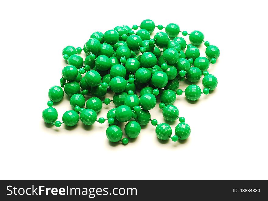 Green plastic necklace isolated on white. Green plastic necklace isolated on white