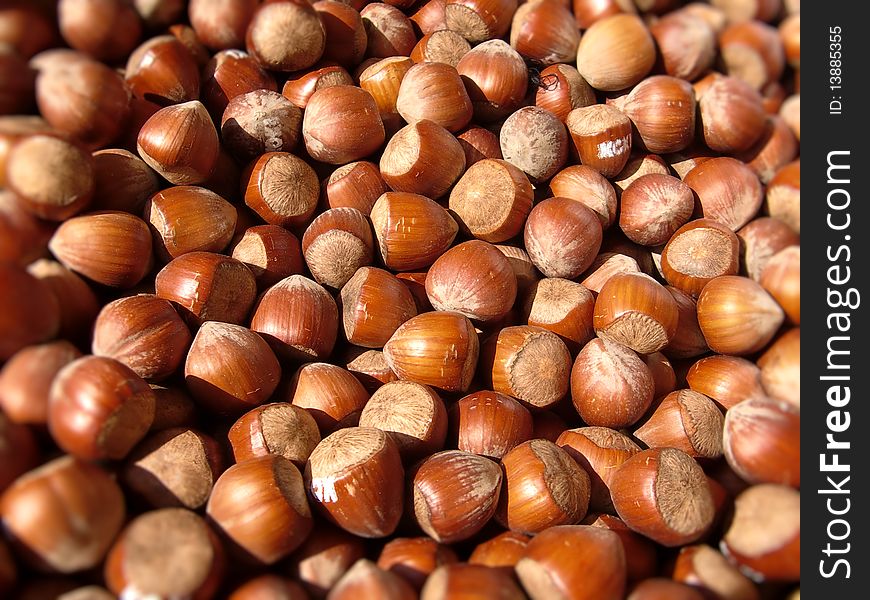 A closeup of unpeeled hazelnuts on a french market