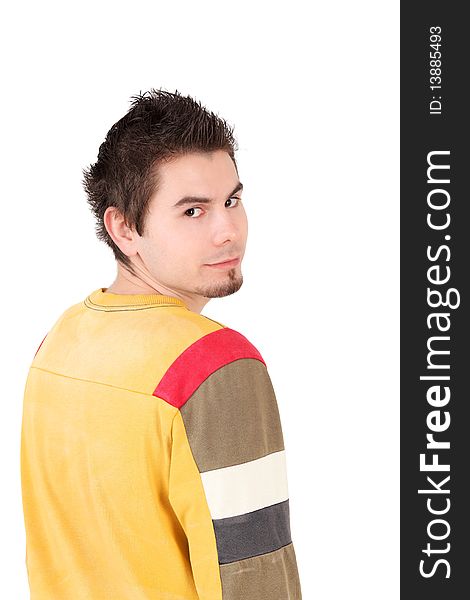 Rear view portrait of young man looking at camera, studio shot