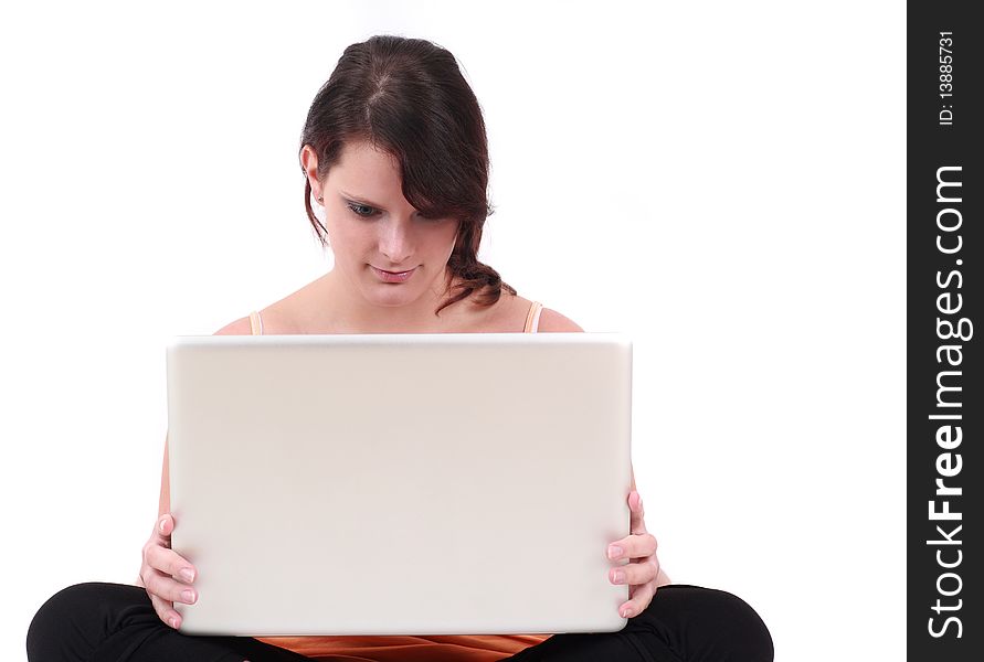 Portrait of teenage girl sitting and holding laptop. Portrait of teenage girl sitting and holding laptop