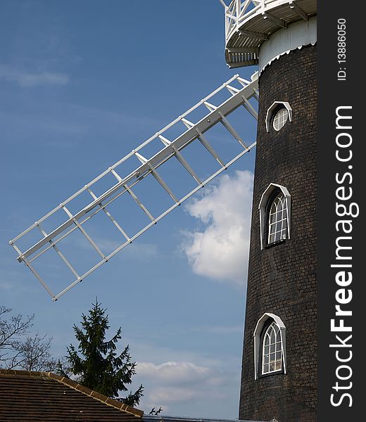 Windmill sails and side of building Surrey England. Windmill sails and side of building Surrey England