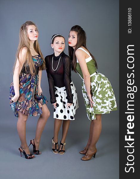 Three happy retro-styled girls studio shot