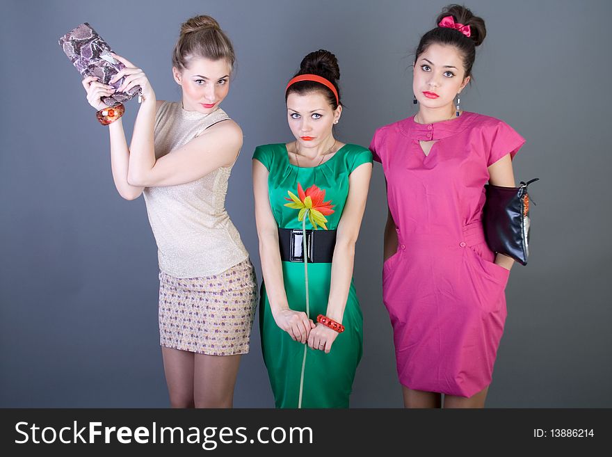 Three happy retro-styled girls studio shot