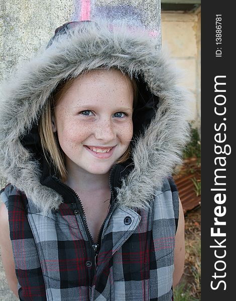 A cute white, caucasian girl child with a winter jacket. A cute white, caucasian girl child with a winter jacket