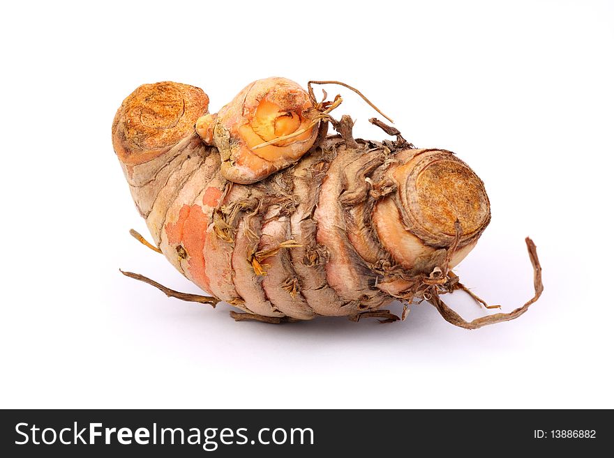 A piece of root ginger isolated on white background.