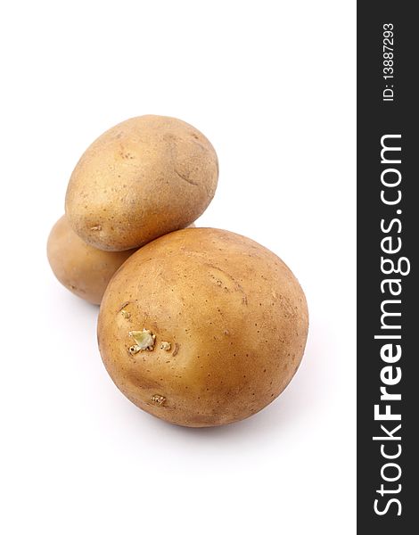 Three potatoes isolated on white background.