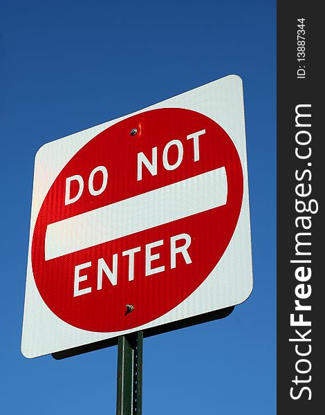 Do not enter sign against a blue sky