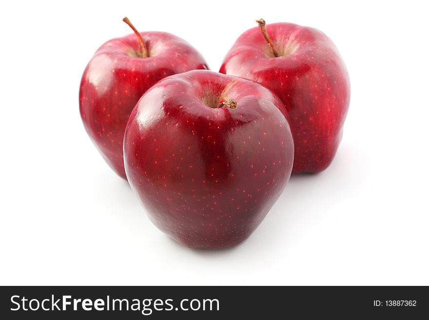 Three perfect red apples isolated on white background. Three perfect red apples isolated on white background.