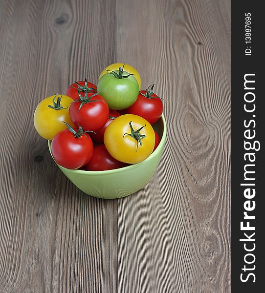 Organic colorful tomatoes in green bow. Organic colorful tomatoes in green bow