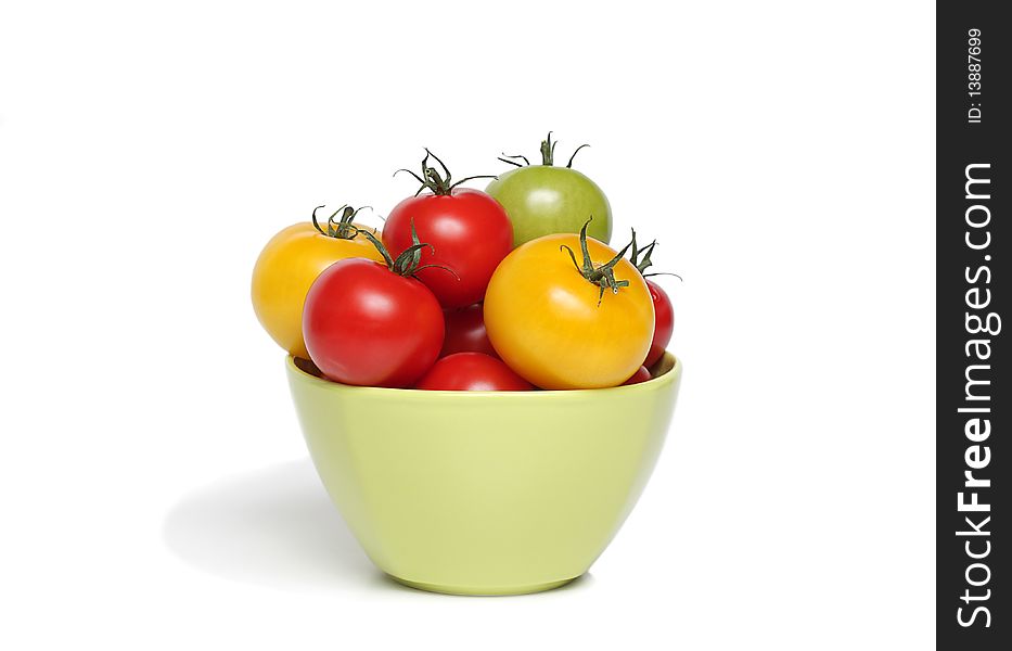 Organic tomatoes in green bowl. Organic tomatoes in green bowl