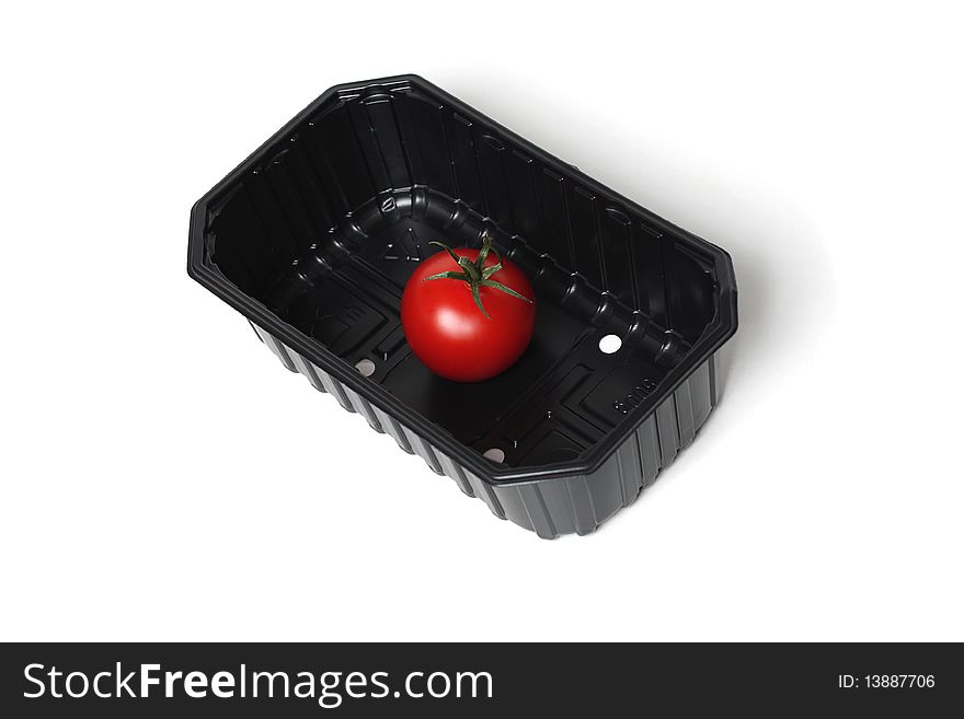 Organic red tomato in food container