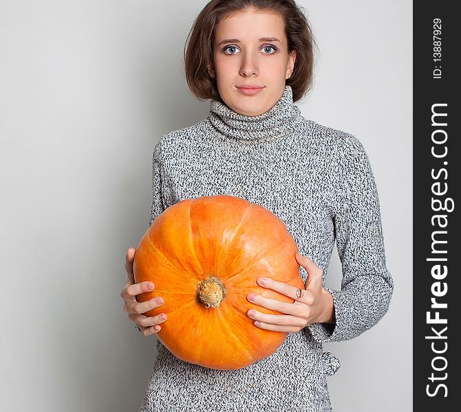 Young Girl And Pumpkin