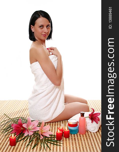 The girl in a towel on a white background