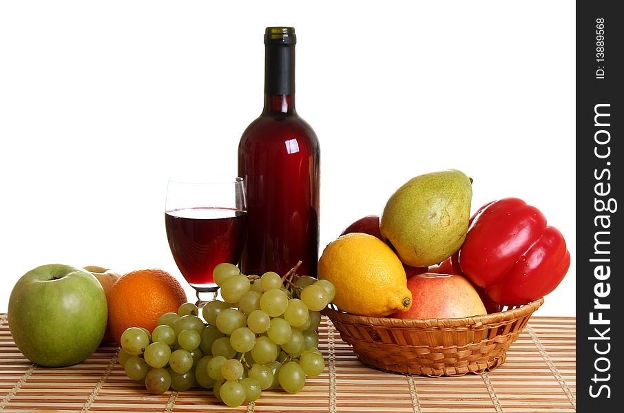 Wine and fruit on a white background