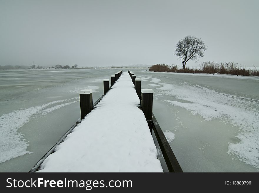 A grey and cold winterday at a small lake. A grey and cold winterday at a small lake