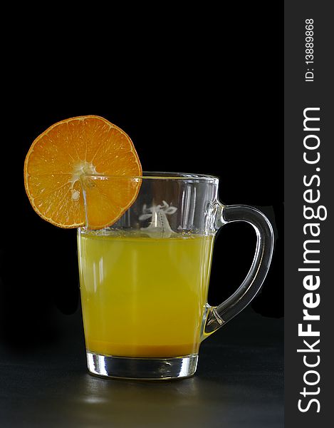 Citrus juice against the black background