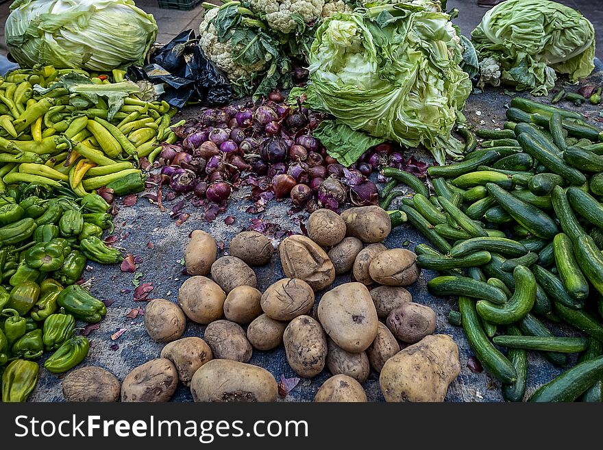 Plastic boxes with fresh vegetables on the counter of the Arab market