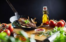 Prepared Grilled Steak With Herbs In A Skillet Royalty Free Stock Image