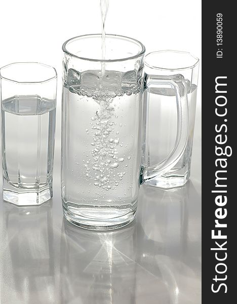 A glass of mineral water on a light background