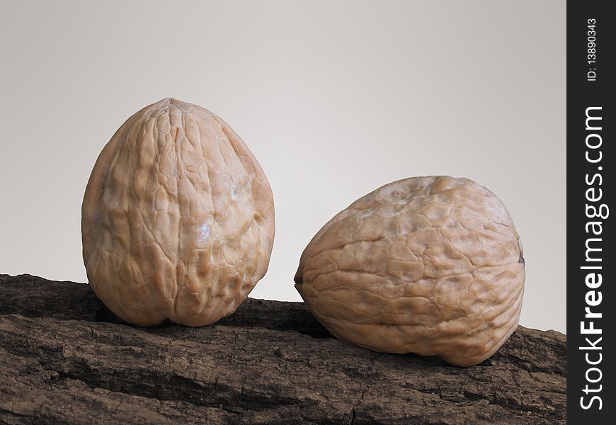 Two Walnuts on a tree, one vertical and the other is horizontal. Two Walnuts on a tree, one vertical and the other is horizontal