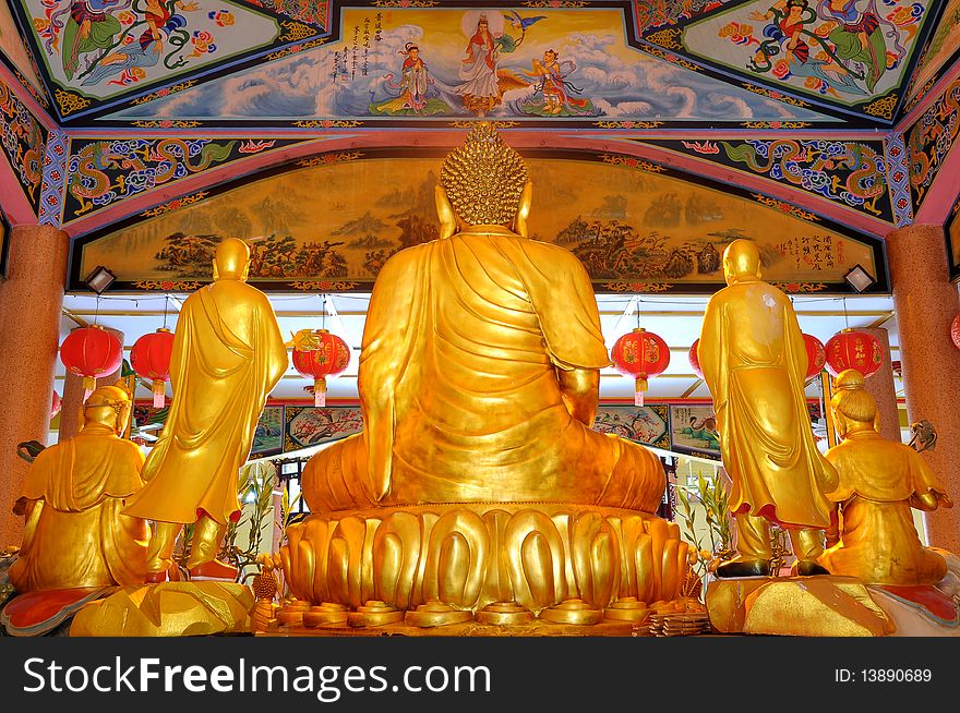 Back view of golden buddha statue