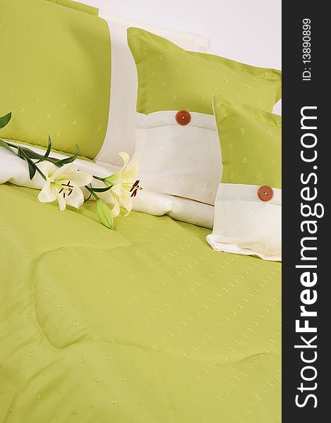 Green bed with three pillows. Green bed with three pillows.