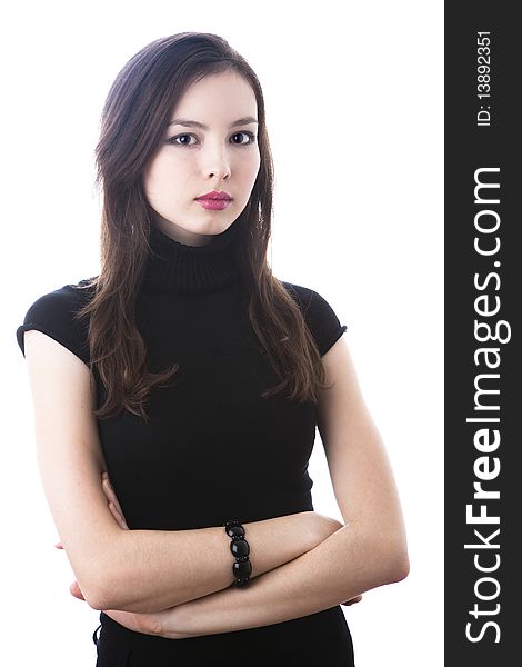 Portrait of a beautiful young woman in black dress isolated on white