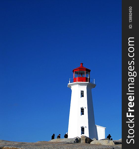 The famous lighthouse at Peggy's Cove, Nova Scotia, Canada. The famous lighthouse at Peggy's Cove, Nova Scotia, Canada