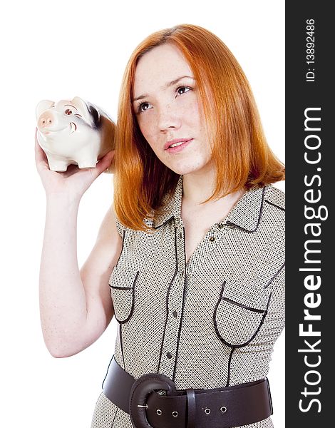 Young woman with piggy bank isolated on white