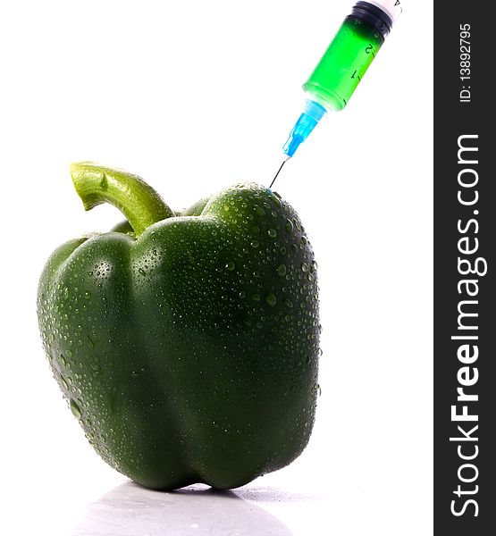 Green Pepper With Syring Injecting Color Into It