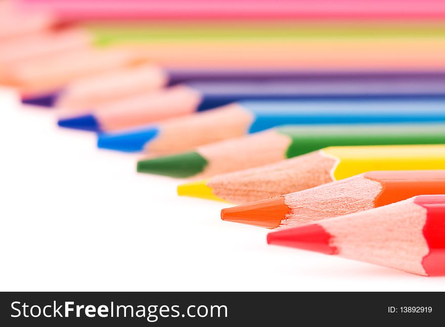 Close-up image of multicolor pencils isolated on white background