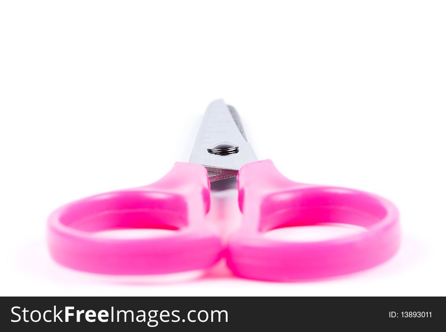 Small pink scissors isolated on white background