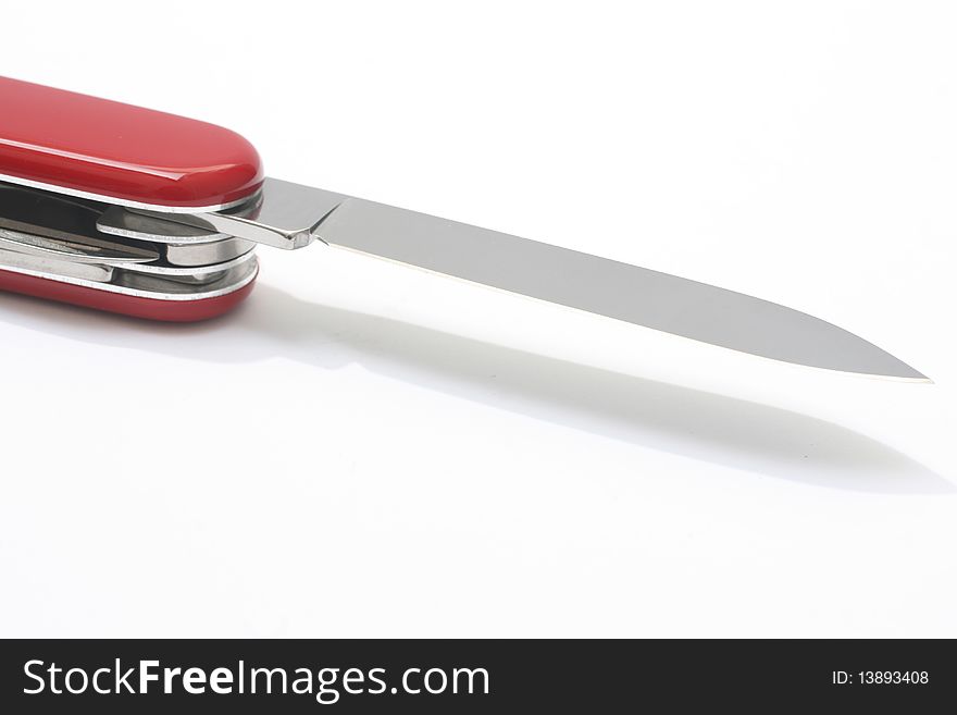 A red swiss army knife isolated on white