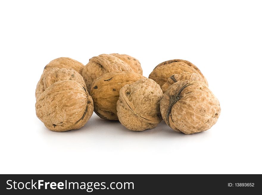 Small group of walnuts. Isolated on white background.