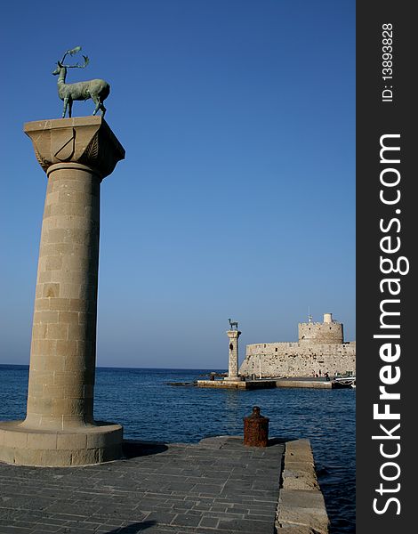 Pillars on the entrance to the harbour of Rhodes capital in Greece