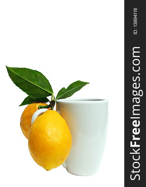 Lemons and mug isolated on white background with clipping path.