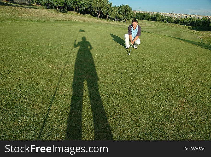 Golfer and shadow