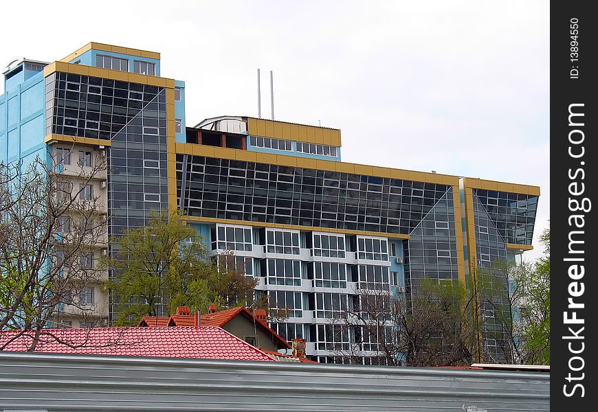 Just builded stylish new office building over sky background